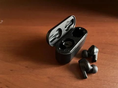 Wireless earbuds with basic black color Stock Photos