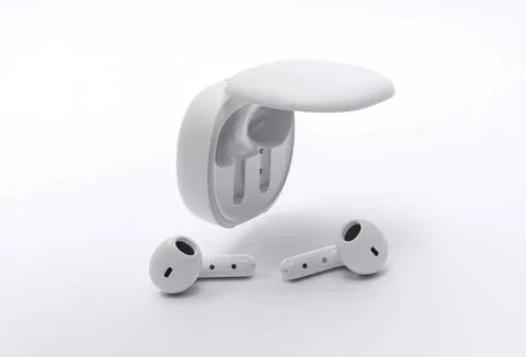 Wireless earbuds with charging case on a white background Stock Photos