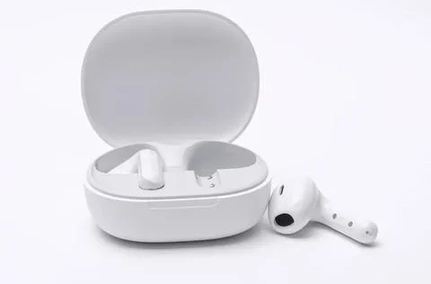 Wireless earbuds with charging case on white background Stock Photos