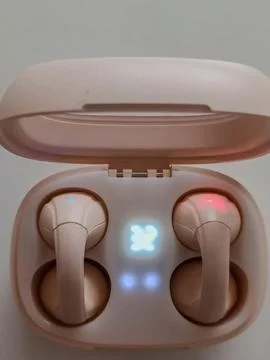 Wireless earphone charging Stock Photos