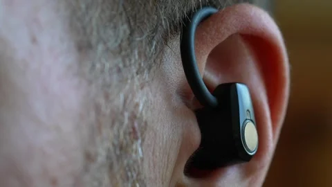 Wireless Earphone/ Earbud Placed Into Man's Ear, Close-Up Stock Footage 313562939