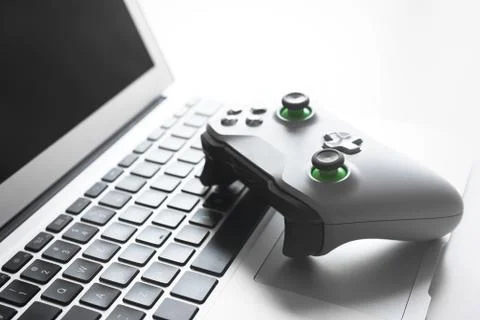 Wireless game pad controller on laptop keyboard 스톡 사진