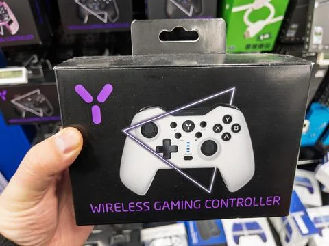 Wireless Gaming Controller Packaging for Console Players Stock Photos