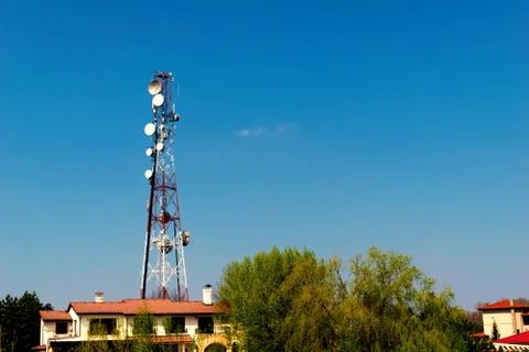 Wireless gsm antenna tower installed in residential area with copy space Stock Photos