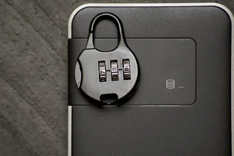 Wireless hard drive with big important data protected by a padlock with the code Stockfoto's