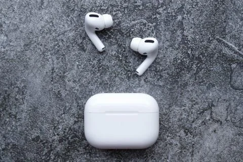 Wireless headphones on a grey factor background Stock Photos