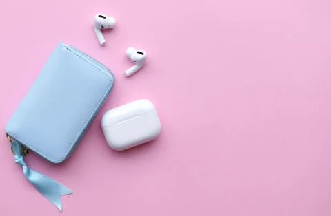 Wireless headphones on a pink background, space for text Stock Photos