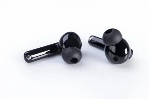 Wireless headphones on a white Stockfoto's