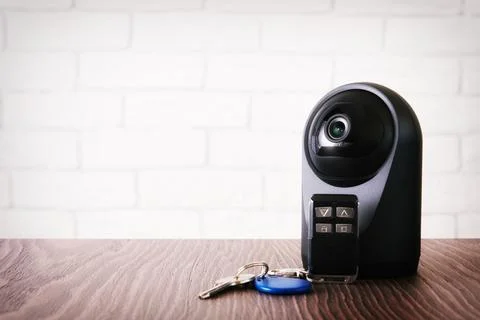 Wireless IP webcam with a motion detection and keys for home access Stock Photos