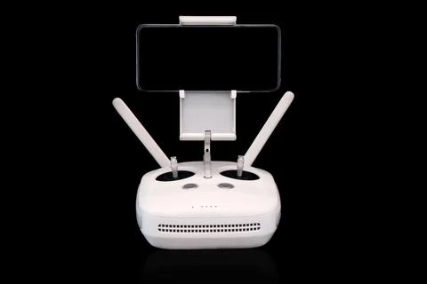 Wireless joystick. drone control panel. with a phone in it. on a black backgr Stock Photos