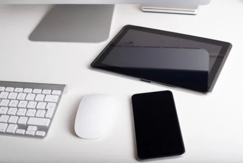 Wireless keyboard, mouse, tablet and smartphone Stock Photos