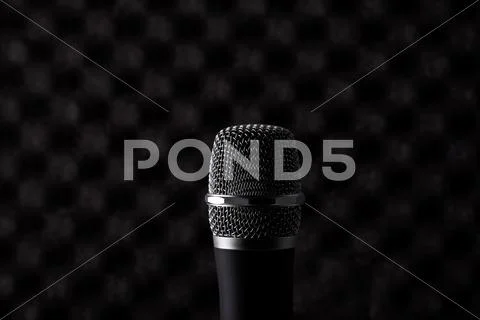Wireless Microphone Closeup On Foam Acoustic Background