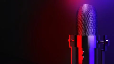Wireless microphone placed on a table with a black background and red and b.. Stockfoto's