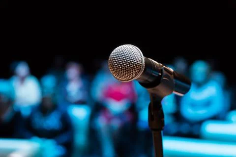Wireless microphone on the stand. Blurred background Stock Photos