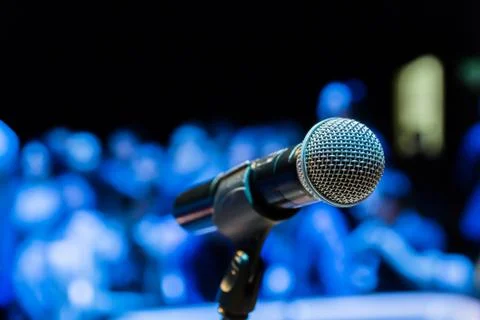 Wireless microphone on the stand. Blurred background Stock Photos
