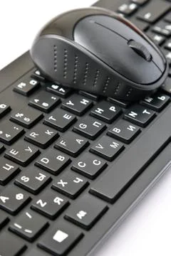 Wireless mouse and keyboard with Russian and English letters Stock Photos