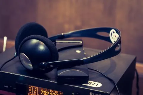 Wireless multy language headphones set on the chairs in conference room Stock Photos