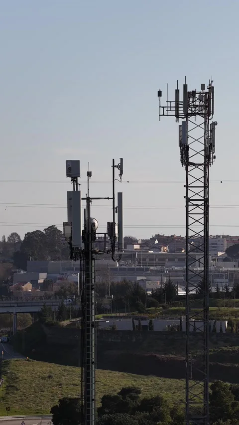 Wireless Network Tower and Highway Traffic Drone Footage Stock Footage 335890931