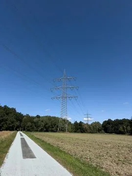 Wireless power transmission system with high-voltage power lines stretching.. Stock Photos