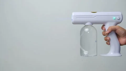 Wireless rechargeable nano blue ray atomizer spray gun Stock Footage 158865601