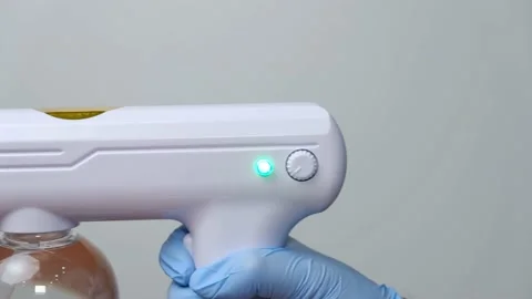 Wireless rechargeable nano blue ray atomizer spray gun Stock Footage