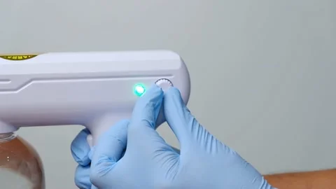 Wireless rechargeable nano blue ray atomizer spray gun Stock Footage 158865625