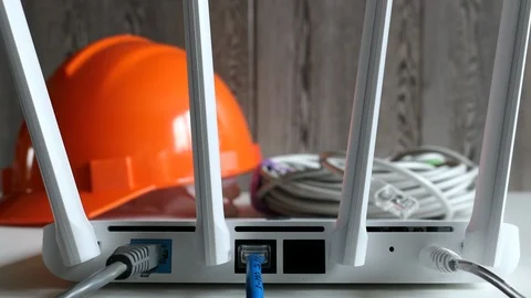 Wireless Router On The Desk, Wires, Cables, Protective Helmet, Panning Slider Sh Stock Footage 118910730