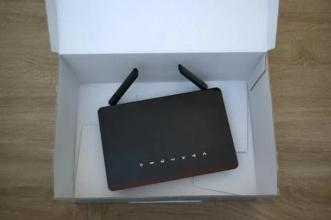 Wireless router inside an open shipping box Stock Photos