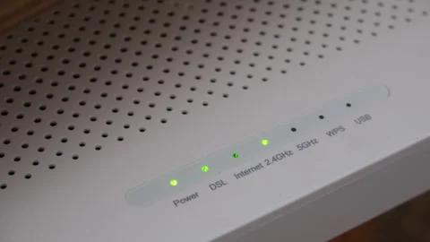 Wireless router internet signal lights flashing on modem Video stock 325787075