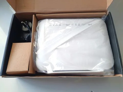A wireless router shows DSL, FXS, WAN, yellow LAN ports, USB, and a power button 写真素材