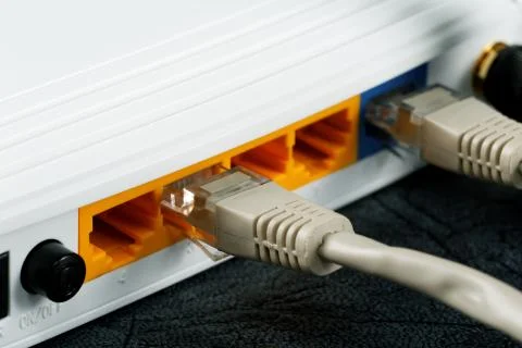Wireless routers and networking cable Stock Photos