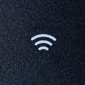 Wireless sign on dark Plastic background Stock Photos