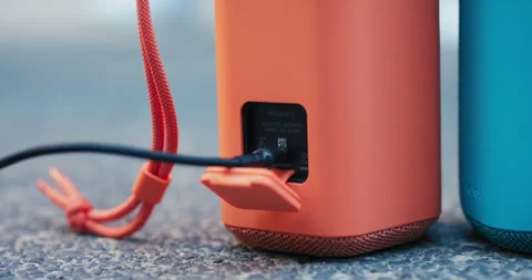 Wireless speaker function powerbank for phone, charging, connecting power cable 스톡 동영상 219575351