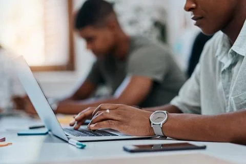 Wireless tech gets the work done. a businessman using a computer in a modern Stock Photos
