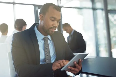 Wireless technology keeps him constantly connected to business operations. a Stock Photos