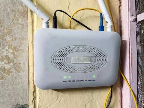 Wireless WiFi Router Installed On Wall With Fiber Optic Internet Network Co.. Stock Photos