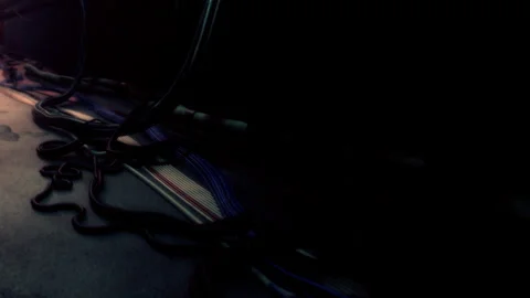 Wires and cables arranged on the floor with minimal light in dark space Stock Footage 342817039