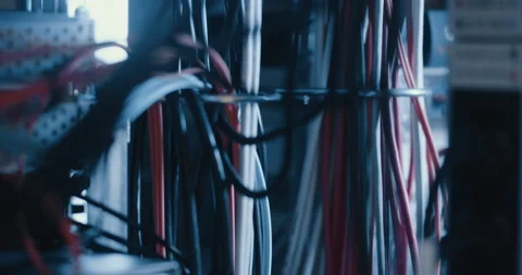 Wires and cables plugged into electrical outlets at a lab Stock Footage 254920826