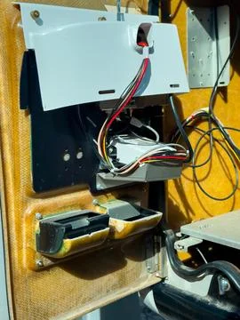 Wires and components inside an electronic device showing connectors and par.. 库存照片