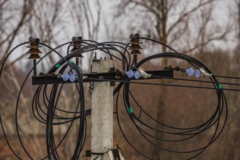 The wires are twisted on the pole Stock Photos