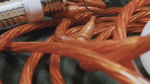 Wires for audio and led light bulbs close-up, 4 K Stock Footage 100707360