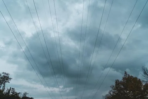 Wires dissect storm clouds Stock Photos