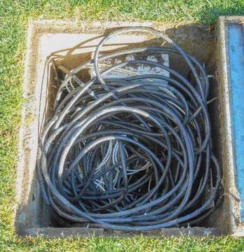 Wires in manhole Foto stock