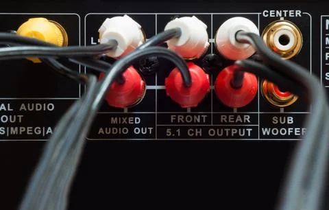 Wires plugged in to the connection panel of a dvd player Stock Photos