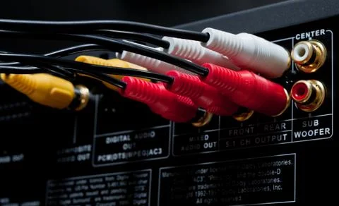 Wires plugged in to the connection panel of a dvd player Stock Photos