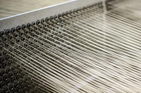 Wires pulled out from machine tool in rolled steel workshop Stock Photos