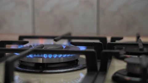 Wiring from left to right along the burning burners of the cooking panel Stock Footage 151920258