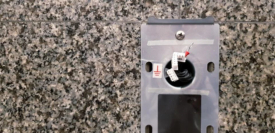 Wiring or electrical cable of Elevator push button switch panel on wall Foto stock