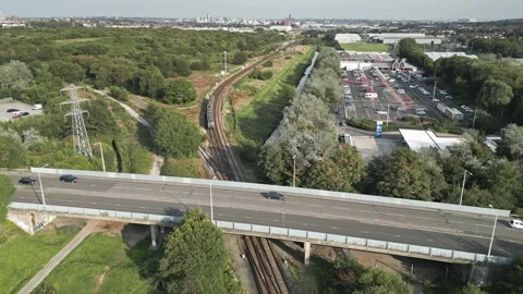 Wirral Line train passes Tesco Bidston, Wirral, England Video stock 285316483