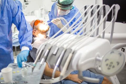 A wisdom tooth extraction surgery in progress in a dental hospital. Dental ch Stock Photos